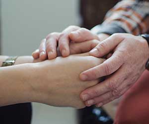 being supportive, holding hands